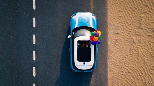 Aerial Photography of Blue Car on Road